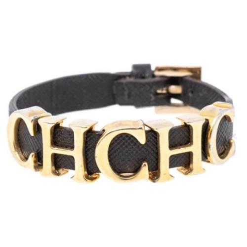 Pre-owned Brunt skinn Carolina Herrera armband