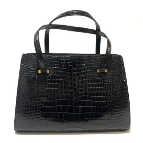 Pre-owned Fabric handbags